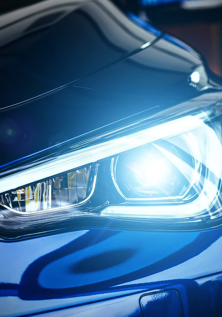 Macro view of modern blue car xenon lamp headlight